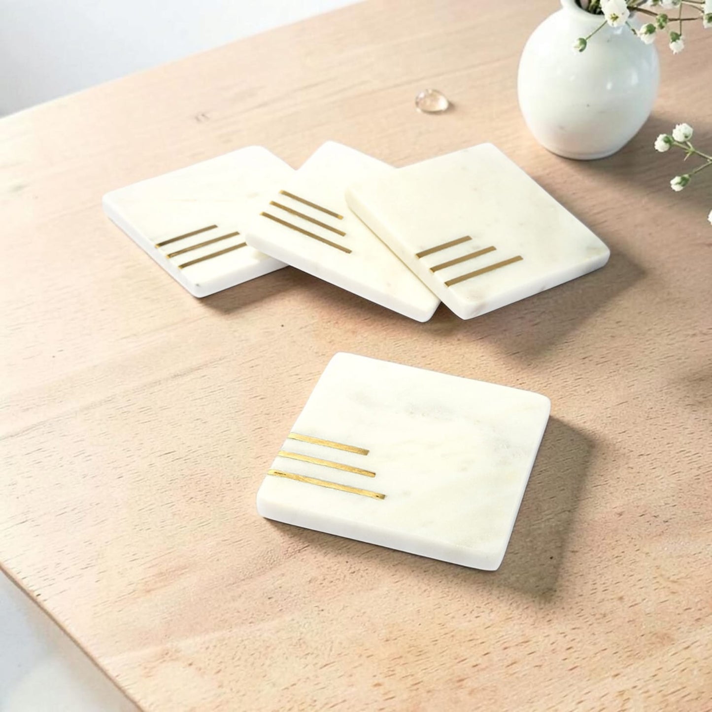 White marble coaster set with brass inlay handcrafted luxury table accessory
