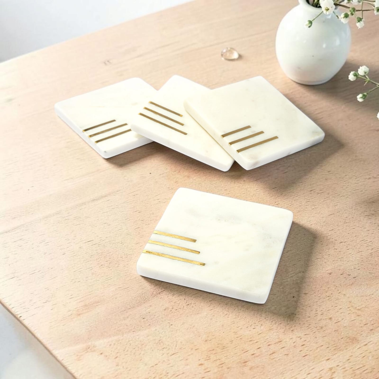 White marble coaster set with brass inlay handcrafted luxury table accessory